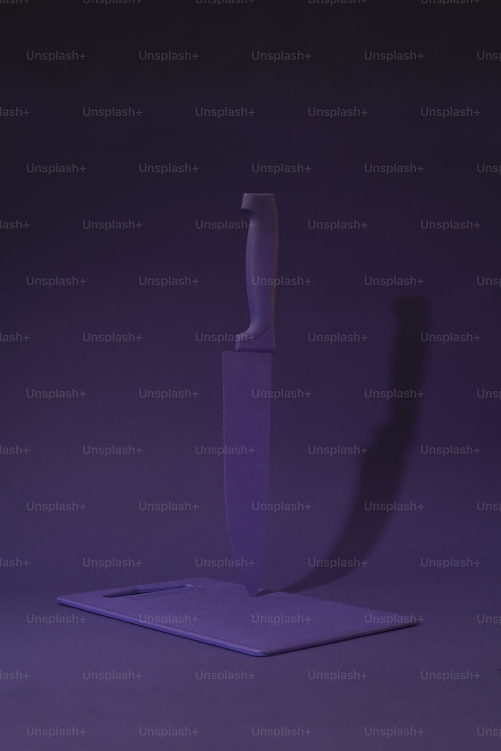a purple knife on a purple background