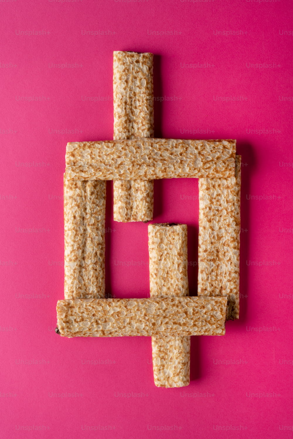 a piece of food that is shaped like a cross