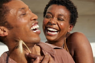 a man and a woman are laughing together