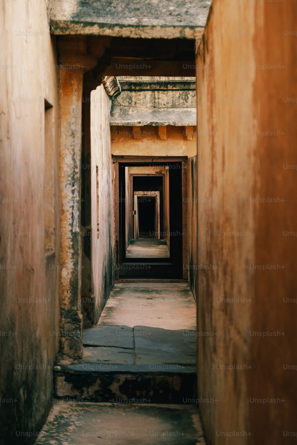 a long narrow hallway in an old building