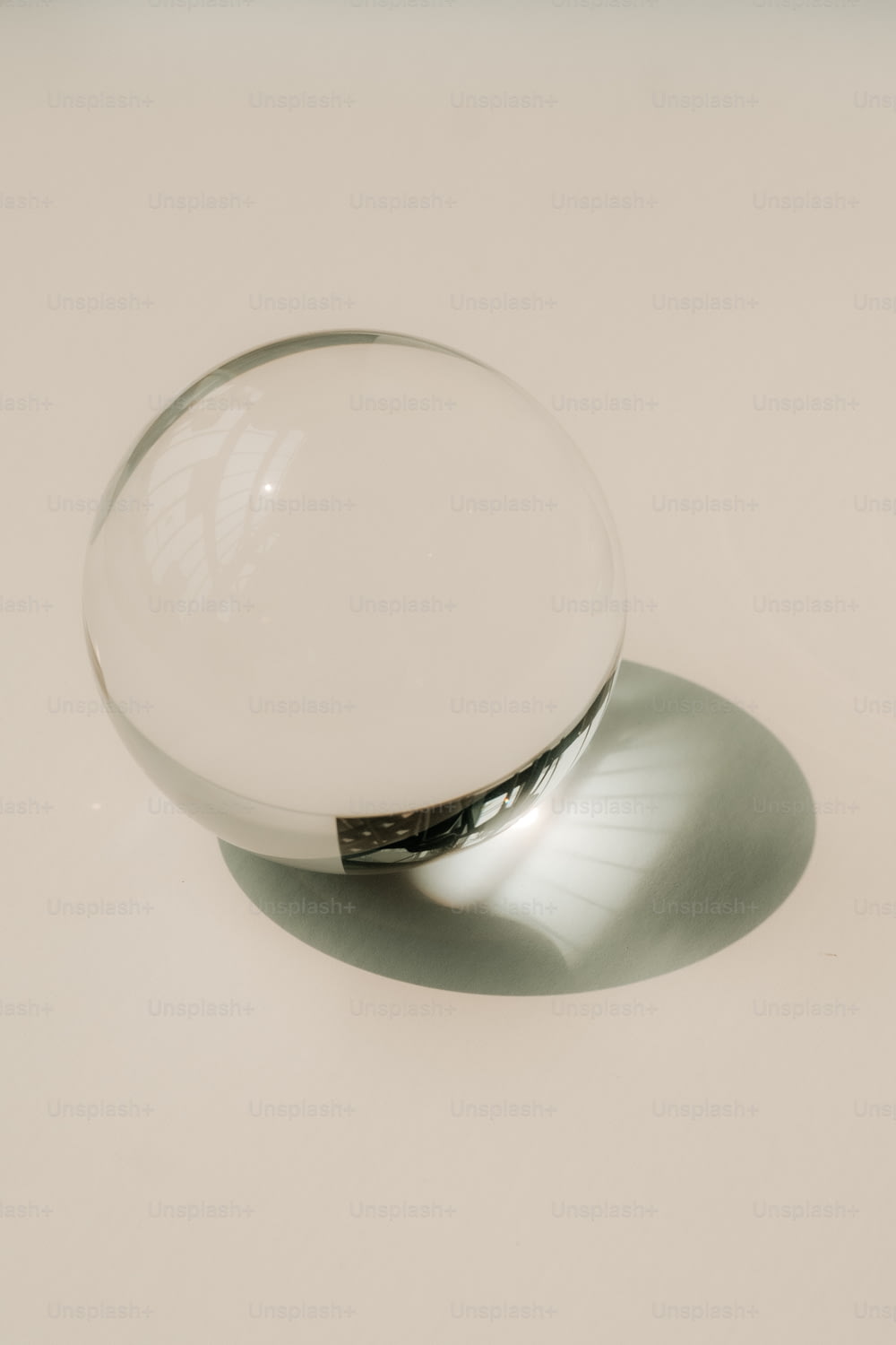 a glass bowl sitting on top of a white table