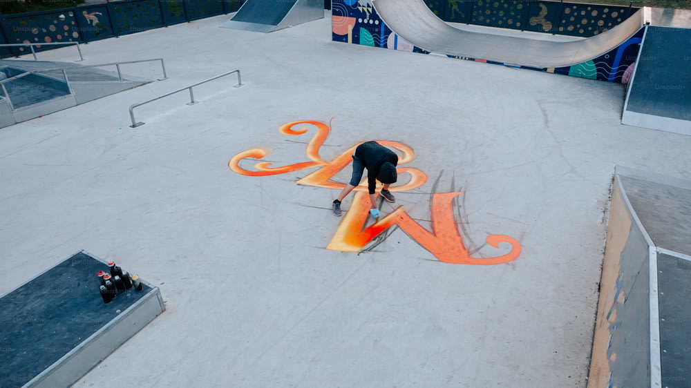 a man on a skateboard in a skate park
