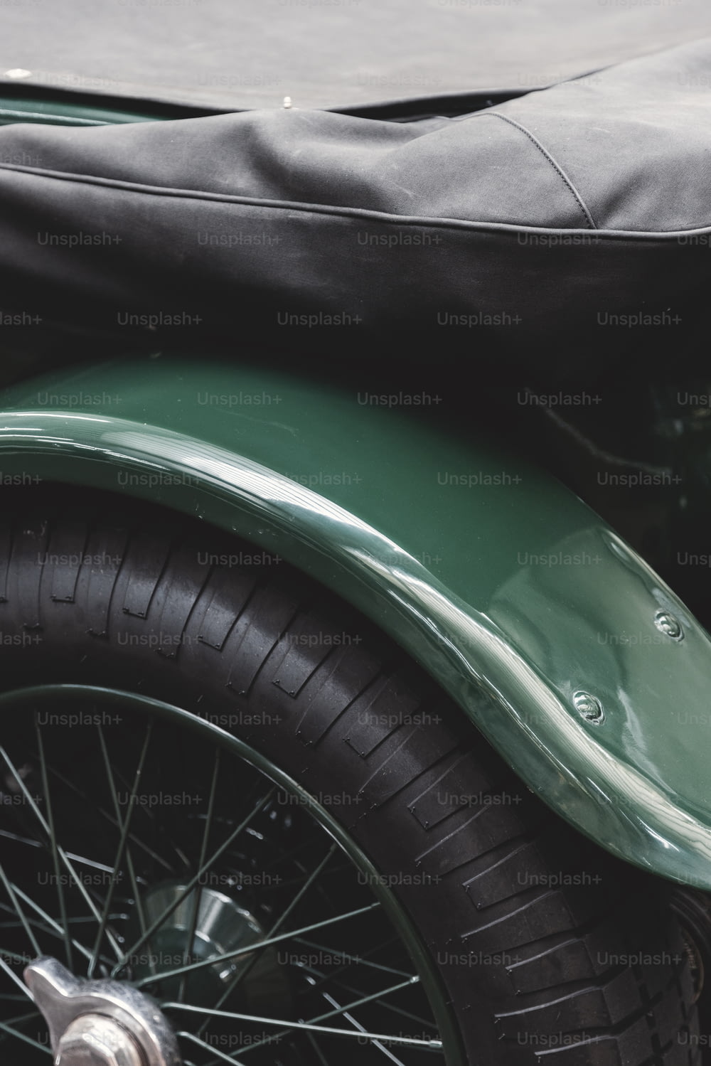 a close up of a motorcycle with a bag on the back