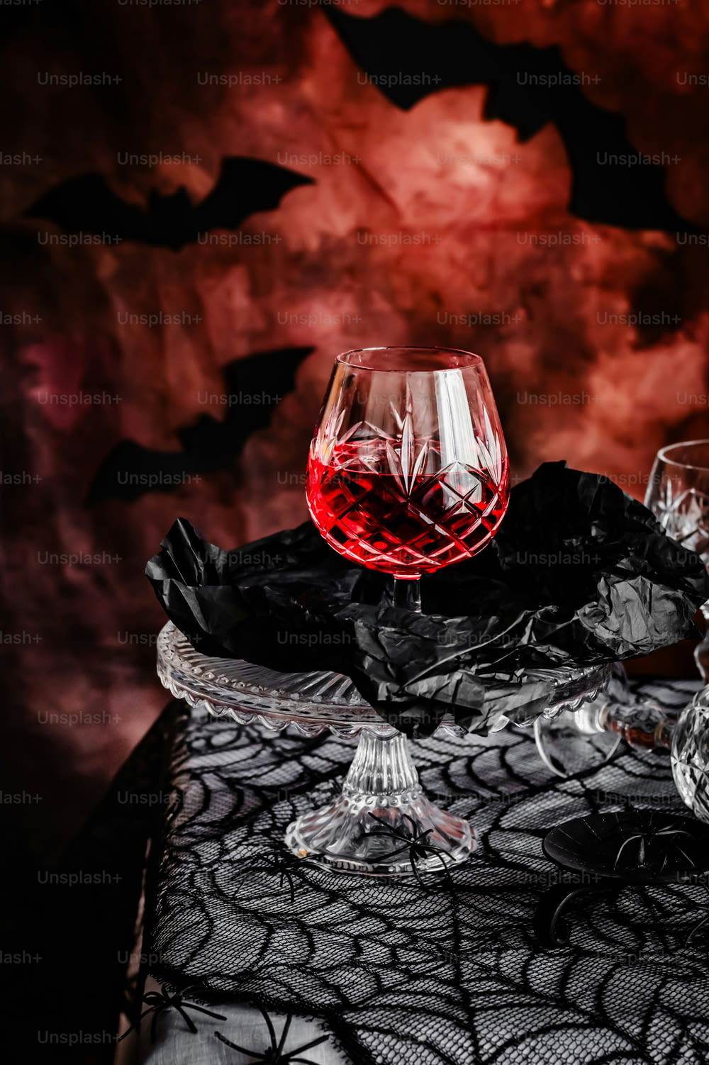 a glass of wine sitting on top of a table