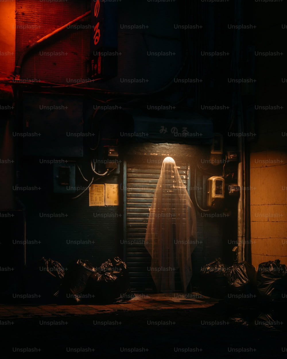 a ghostly ghost standing in a doorway at night