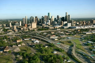 an aerial view of a city with a freeway