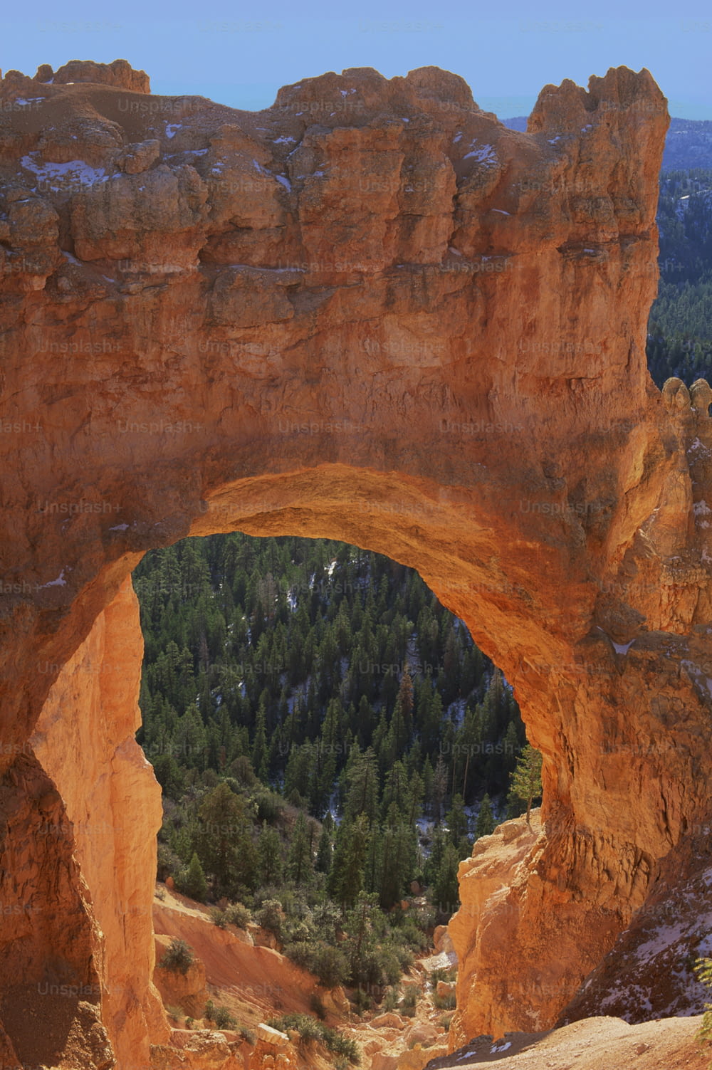 a large stone arch in the side of a mountain