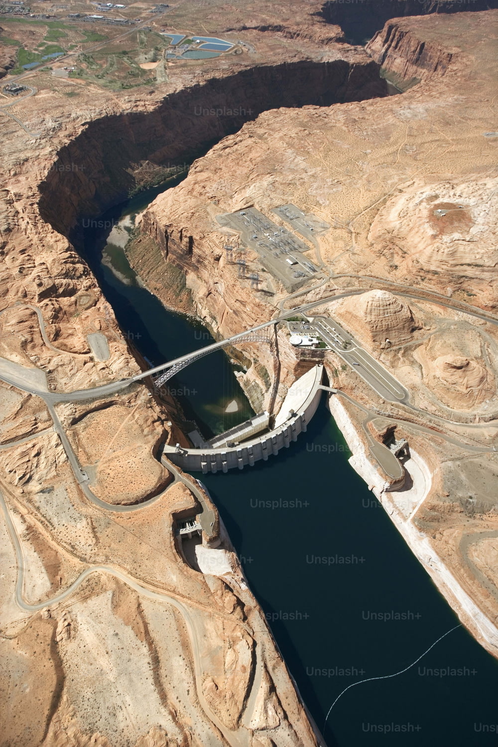 an aerial view of a dam in the desert
