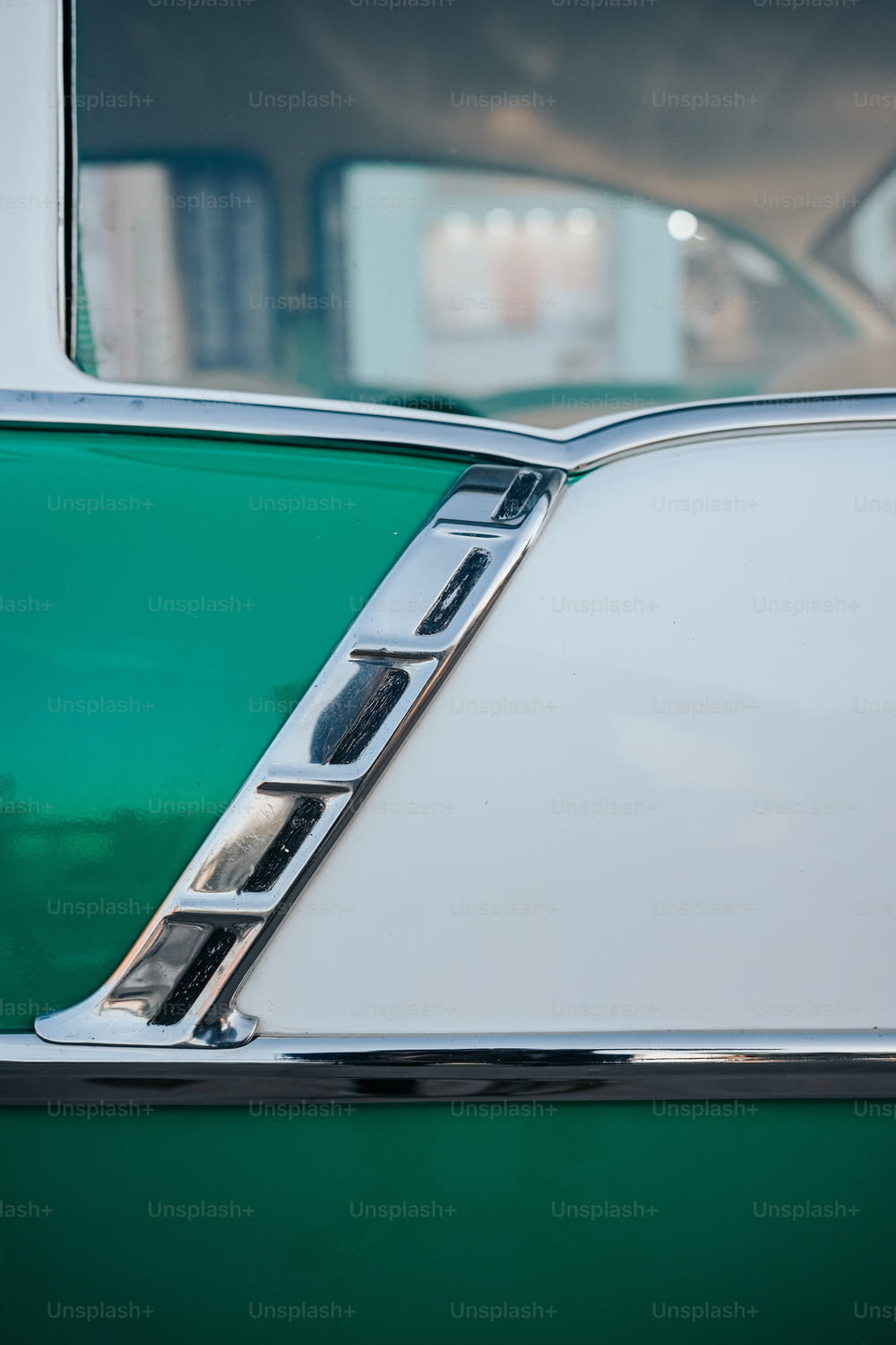 a close up of a green and white car