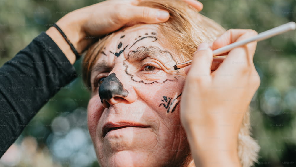 a man with a face painting on his face