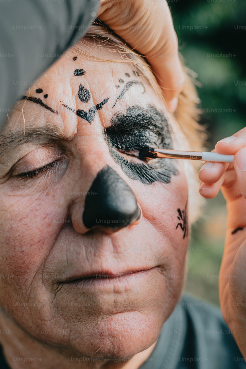 a man with a nose painted to look like a bear