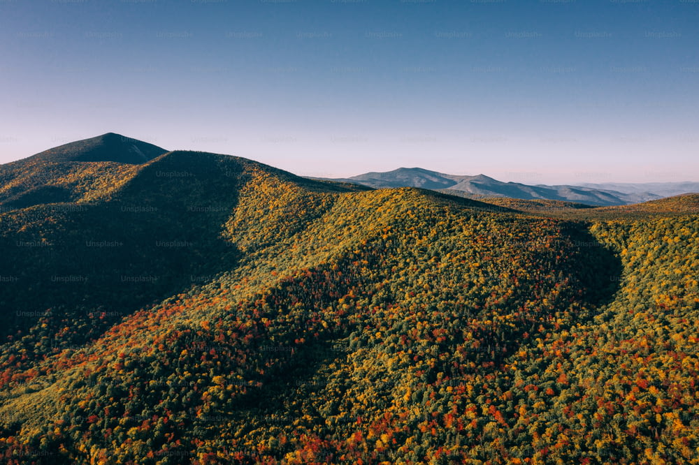 a view of a mountain range in the fall