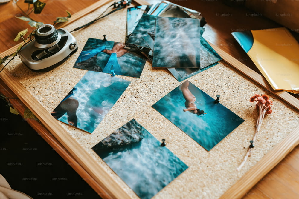 a table topped with pictures of people swimming
