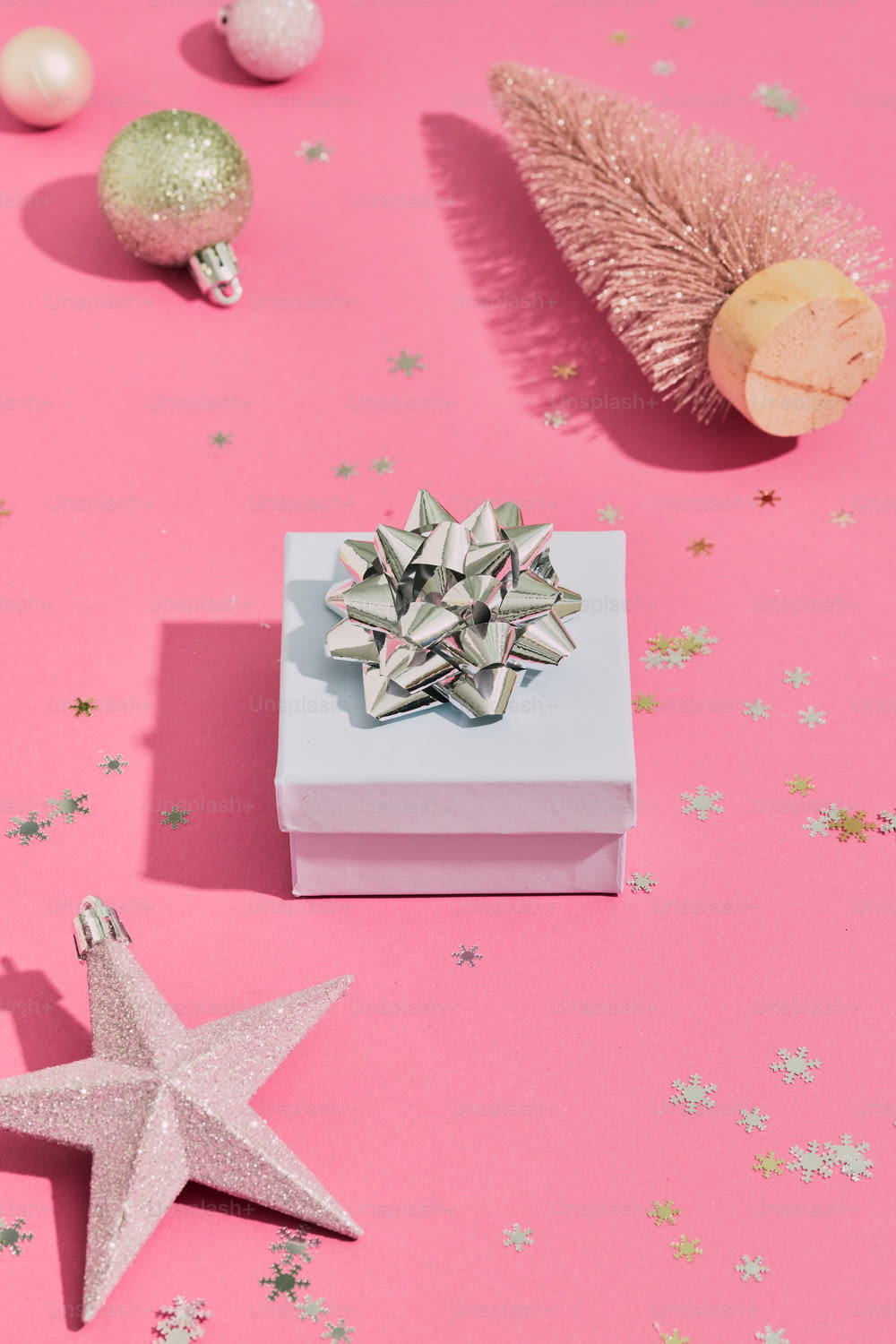 a star ornament sitting on top of a pink table