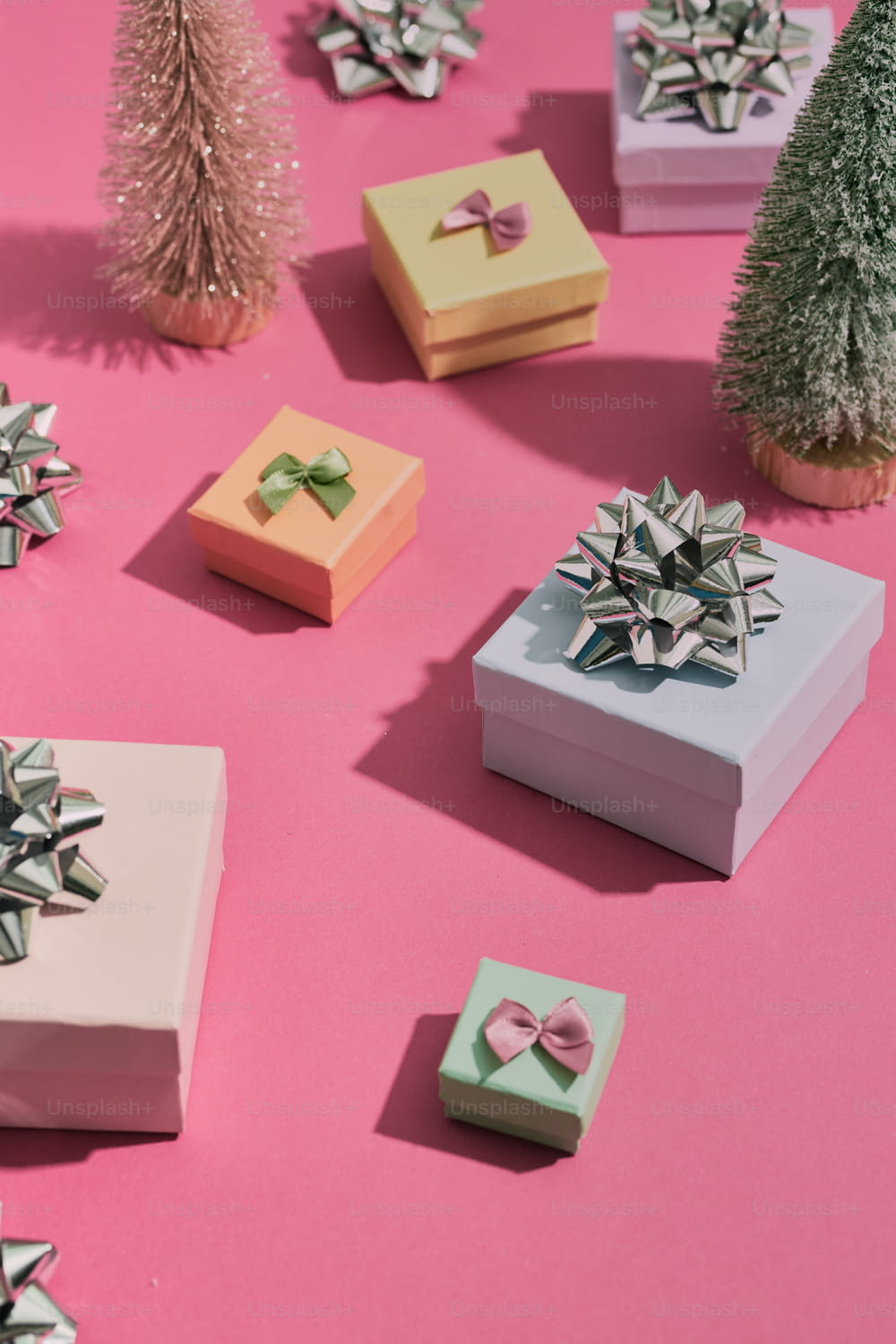 a group of small boxes with bows on them