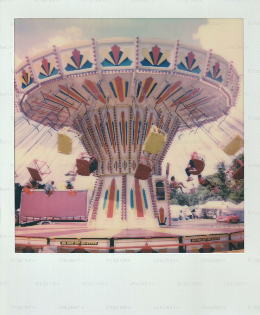 an old photo of a carnival ride