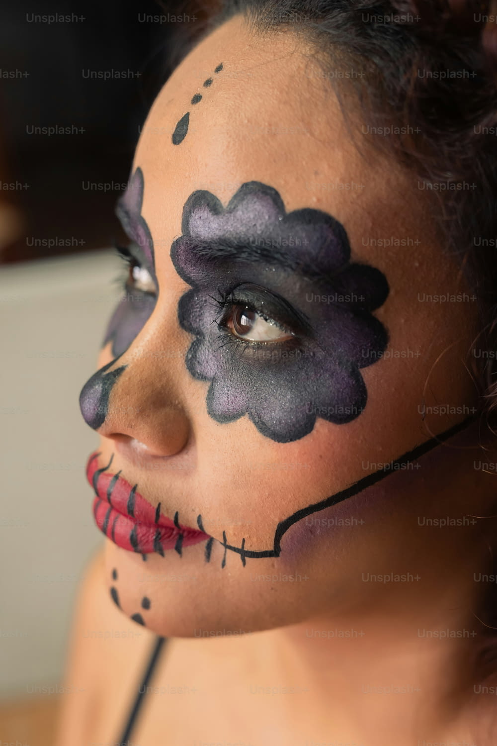 a woman with makeup painted to look like a flower