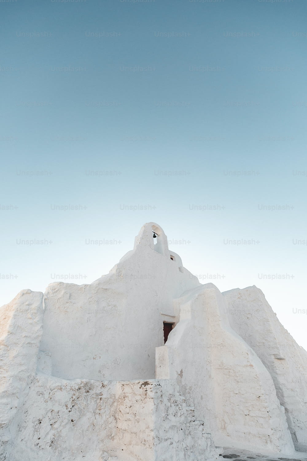 A low angle shot of a Paraportiani Orthodox Church, Mykonos