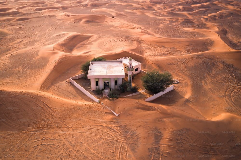 Stranded - An Abandoned Mosque in the desert in the United Arab Emirates (Dubai). The Ghost town lays totally abandoned and covered in sand.
