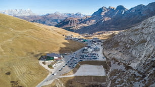 Aerial view of Passo Pordoi mountain pass road in the italian Dolomites near Cortina d'Ampezzo during autumn