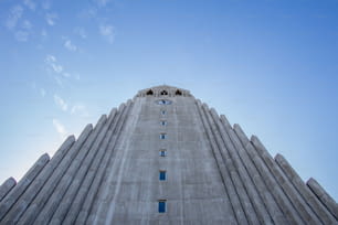 A low angle of Hallgrimskirkja church under a blue sky