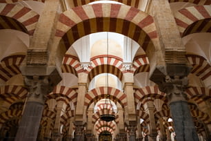 Inside view of the columns and decorated double arches of La Mezquita Catedral (Mosque Cathedral) of Córdoba, Spain.