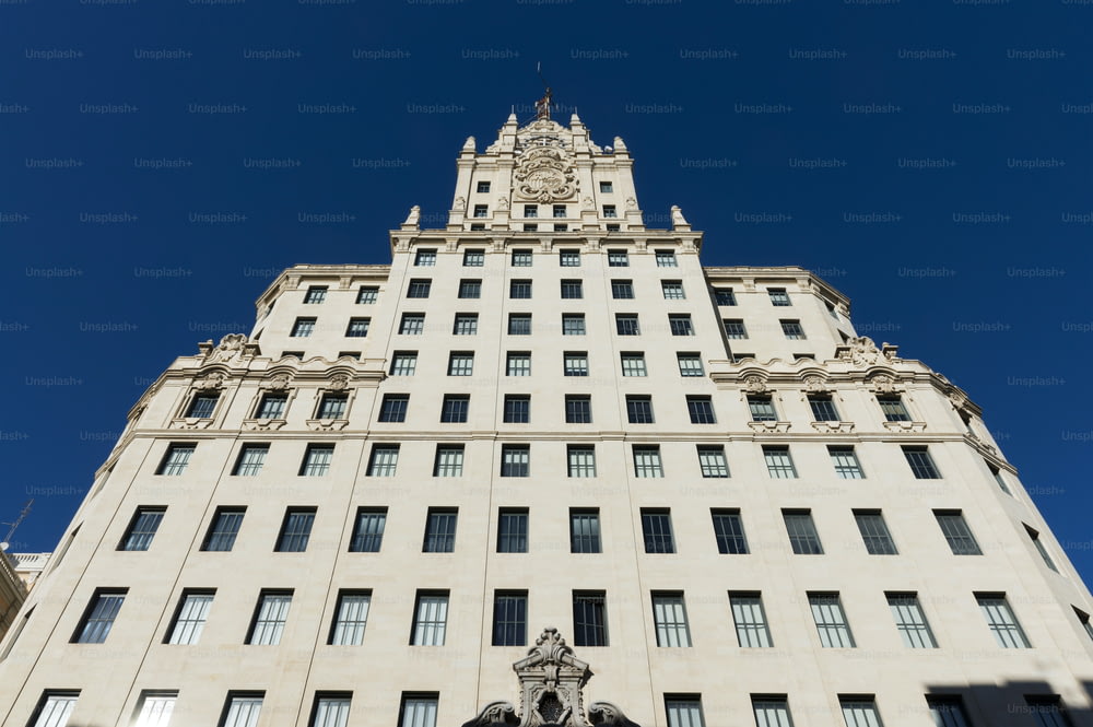 Low angle view of the Telefónica Building in Gran Vía in Madrid, Spain. Designed by Ignacio de Cárdenas after a previous study of Lewis S. Weeks in Manhattan, it was fully completed in March 1929, becoming the first skyscraper in Europe.