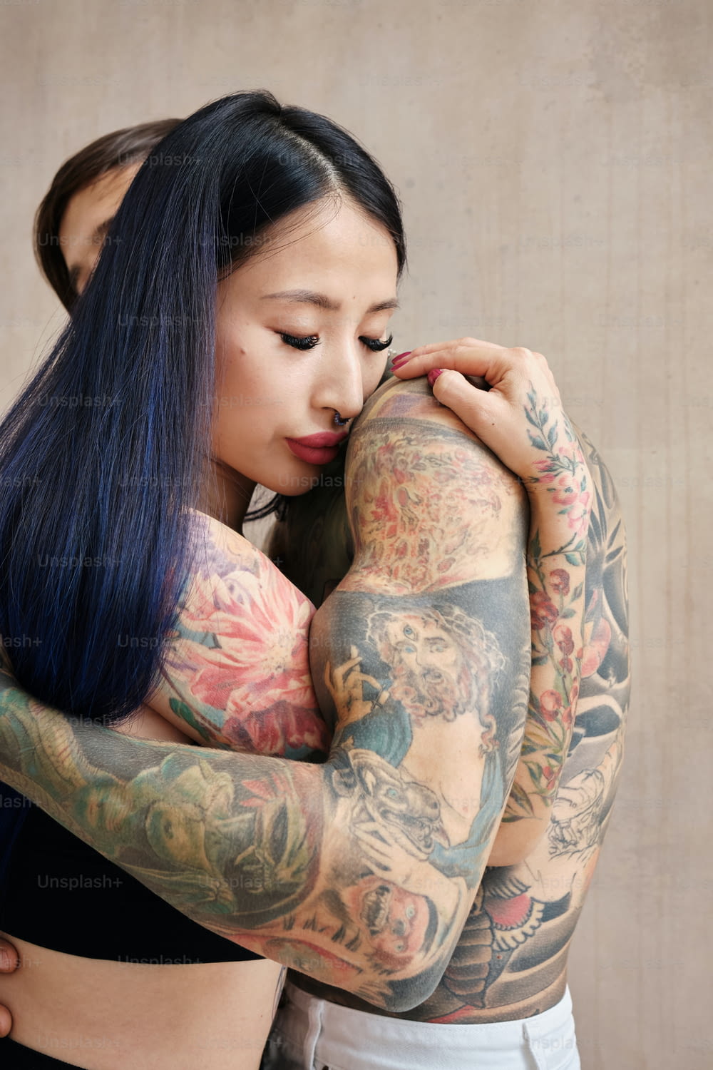 a woman with a lot of tattoos on her arm