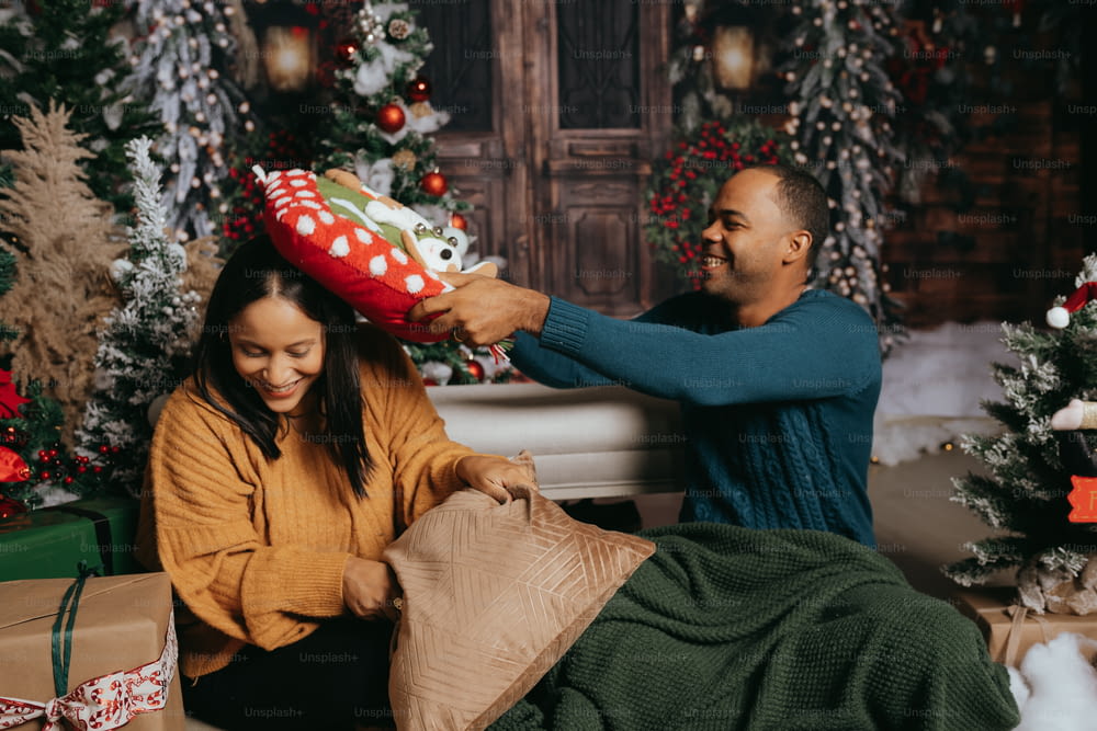 a man giving a woman a christmas present