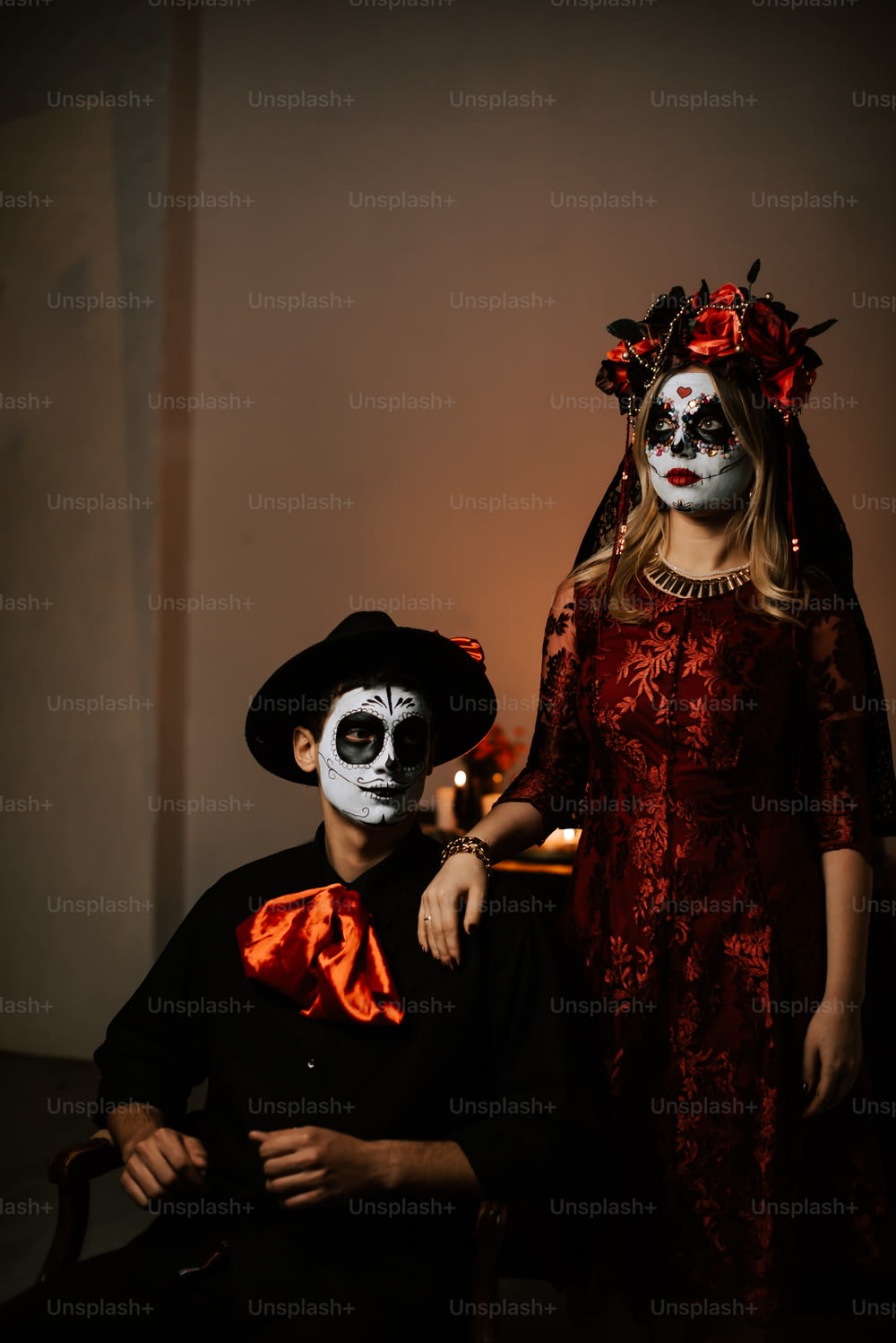 a man and a woman in skeleton makeup