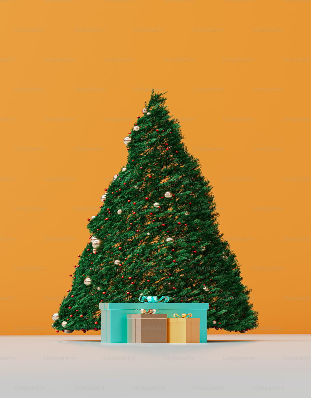 a small christmas tree with a gift box in front of it