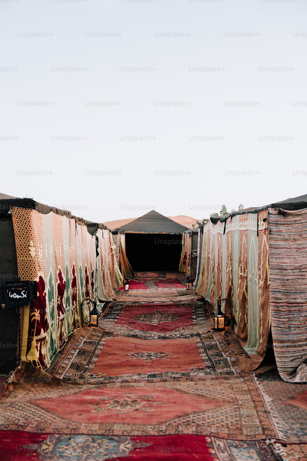 a group of tents sitting next to each other on top of a rug
