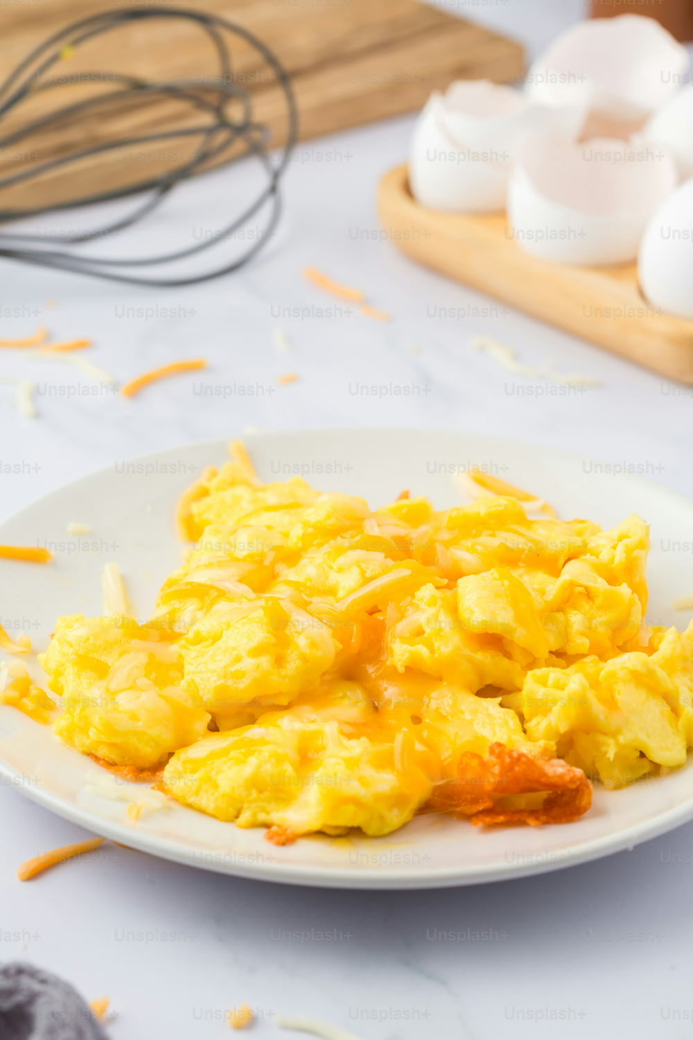 a plate of scrambled eggs on a table