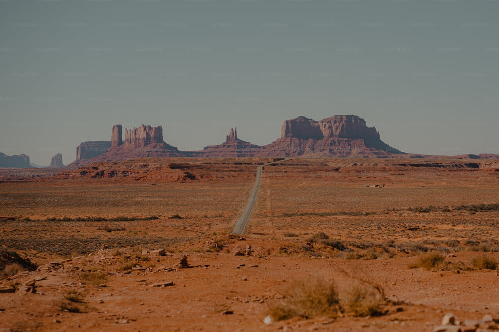 a long road in the middle of a desert