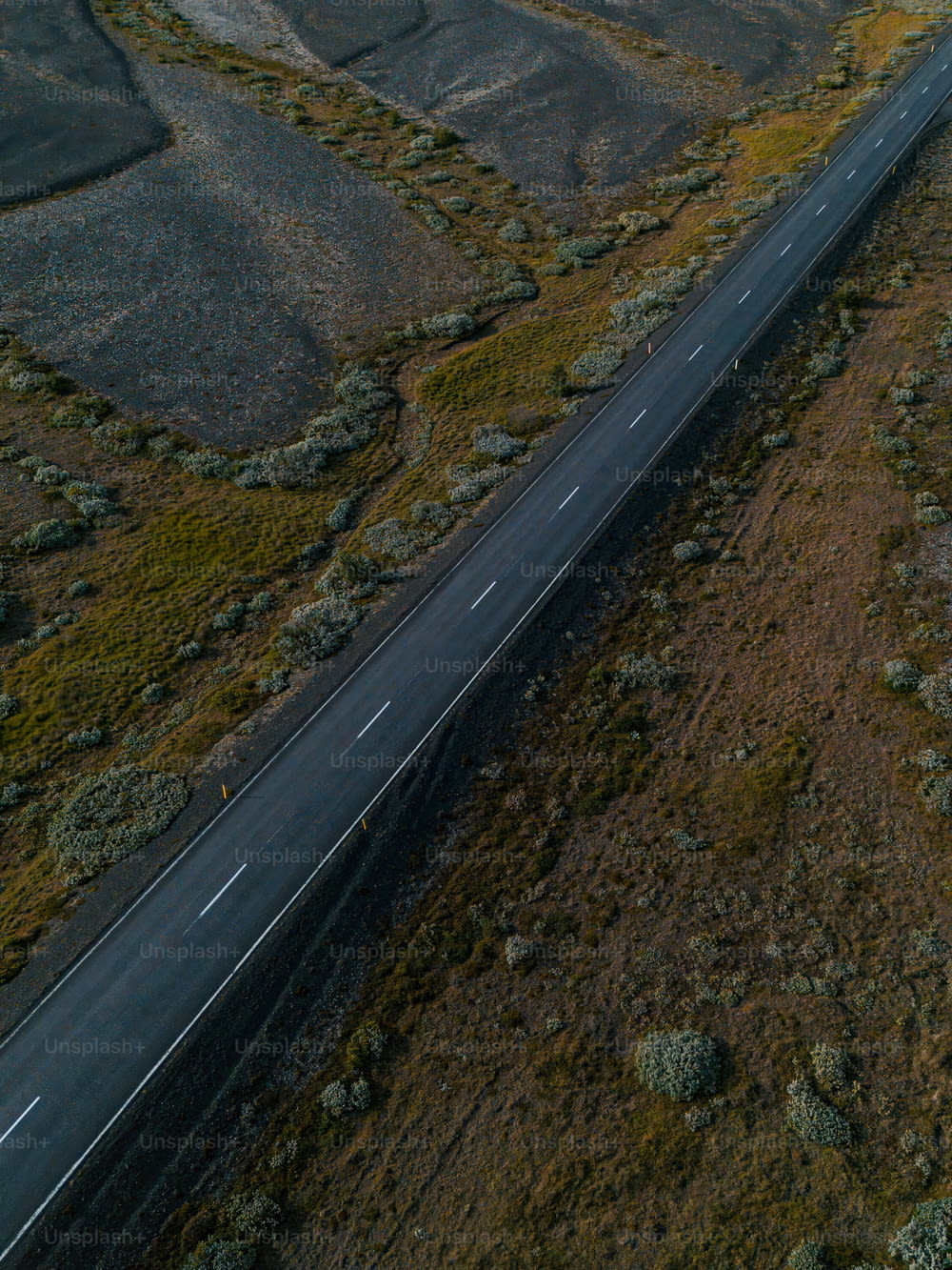 an aerial view of a highway in the middle of nowhere