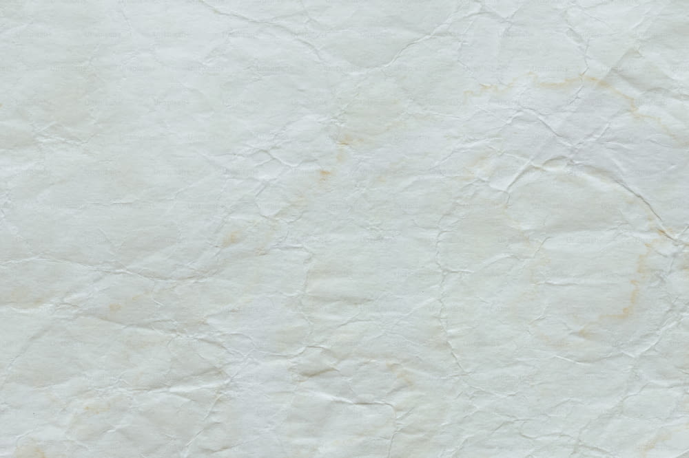 a piece of white paper with some brown stains on it