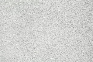 Un primer plano de una pared de estuco blanco