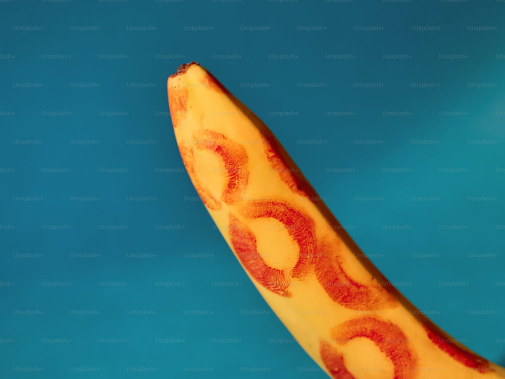 a close up of a banana with a blue background
