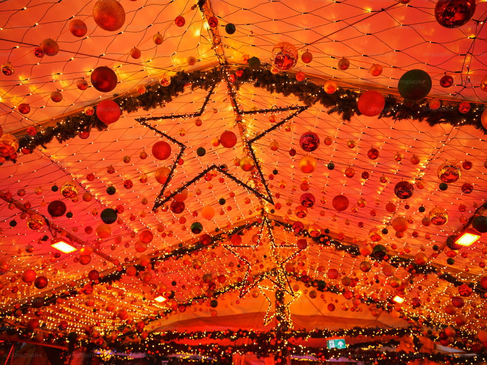 a ceiling covered in christmas lights and decorations