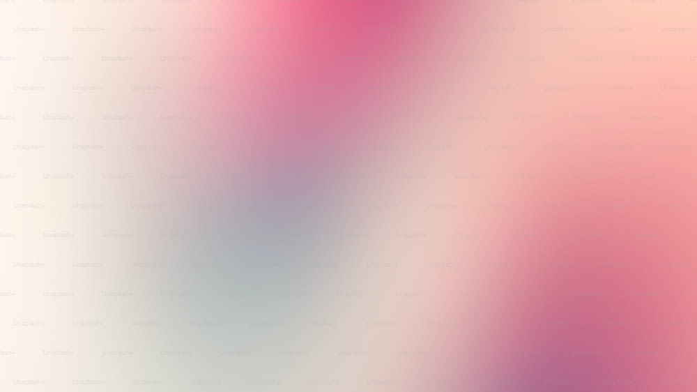 a blurry image of a pink and white background