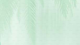ein grüner Hintergrund mit Palmen im Vordergrund