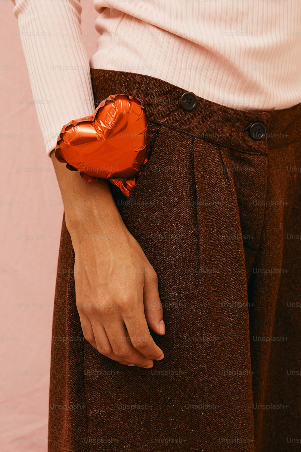 a close up of a person holding a heart shaped object