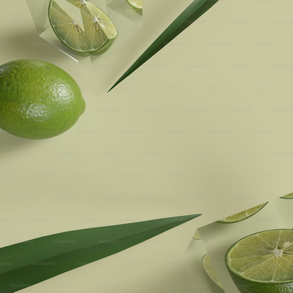 limes and leaves on a light green background