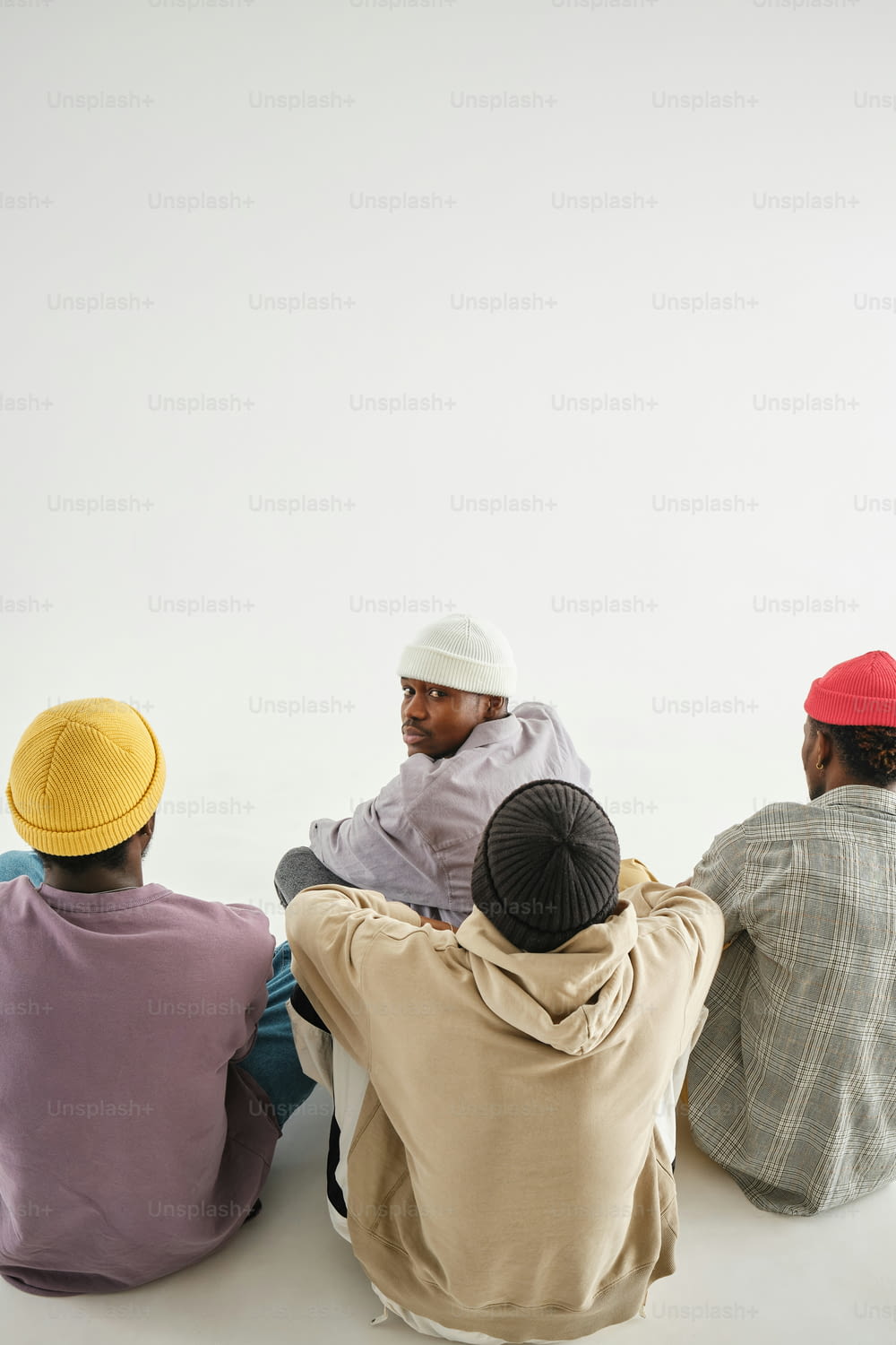 a group of men sitting next to each other