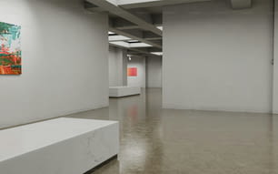 an empty room with white walls and a painting on the wall