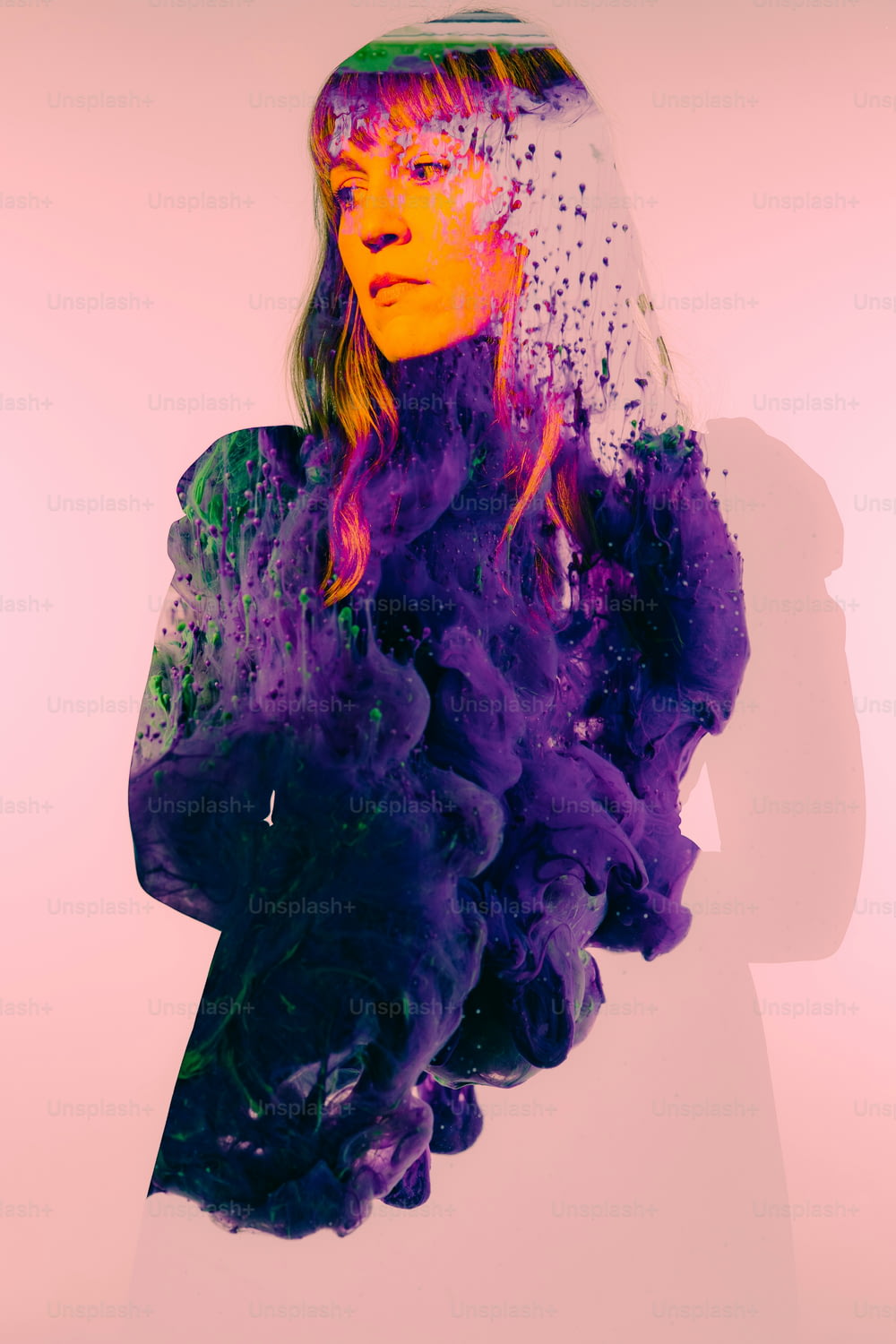 a woman with a veil on her head is covered in purple smoke