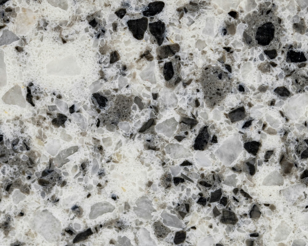 a marble counter top with black and white rocks