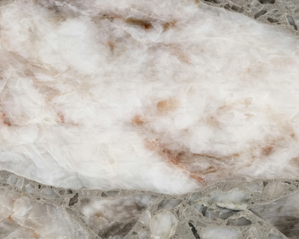 a close up of a rock with a white substance on it