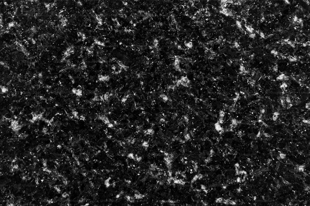 a black and white photo of a granite counter top