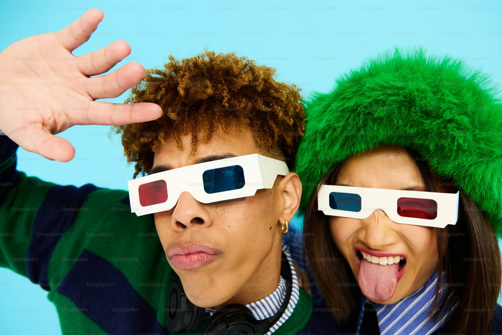 a man and a woman wearing 3d glasses